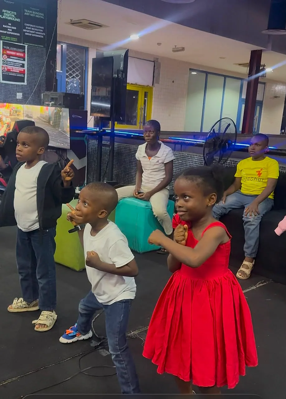 Young guests enjoying group gaming at Player One