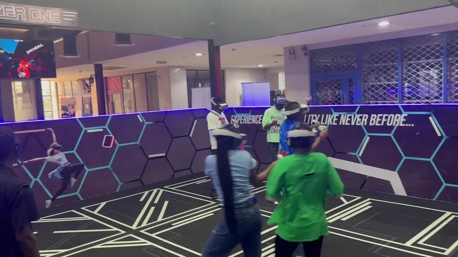 Children enjoying a supervised virtual reality group activity at Player One GameEdu