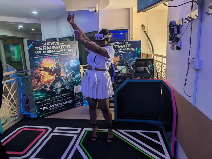 Creator filming a VR arena content moment at Player One Game Cafe