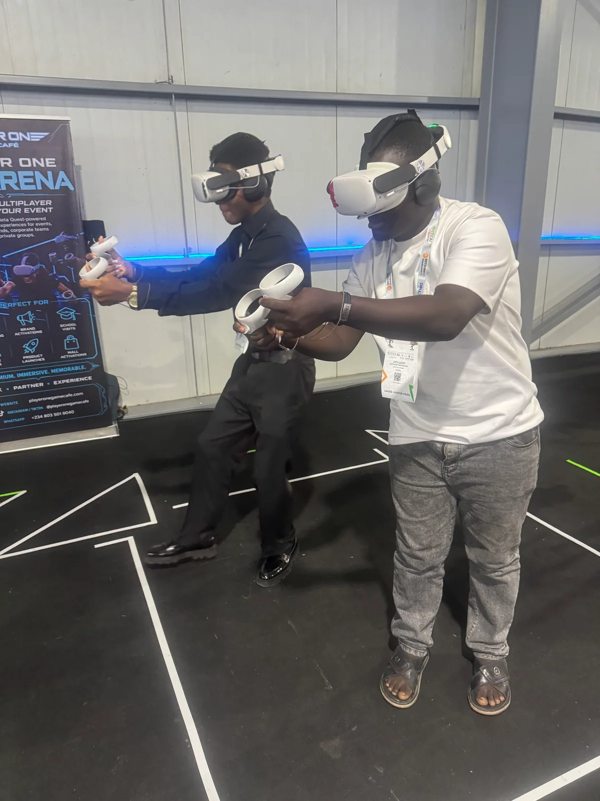 Two delegates playing in the Player One VR Esports Arena at GITEX Nigeria 2026