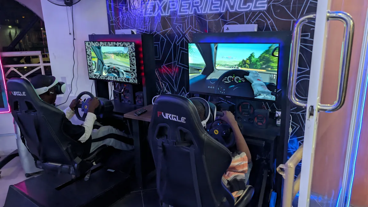 Dual racing simulator setup at Player One VI Silverbird